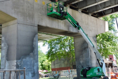 June 2019 - A worker performs repairs on one of the support piers of the Wayne Junction Viaduct.