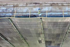 June 2019 - A worker walks on the temporary shielding that is in place on the Wayne Junction Viaduct.