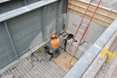 June 2020 - A worker performs repairs on the bridge's steel structural components.