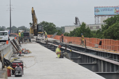 July 2021 - A work crew removes the existing concrete deck from the southbound right lane of the U.S. 1/Roosevelt Expressway Viaduct.