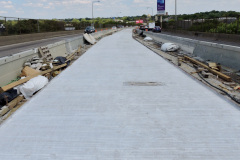 July 2020 - The contractor has begun paving the center area of the expressway.