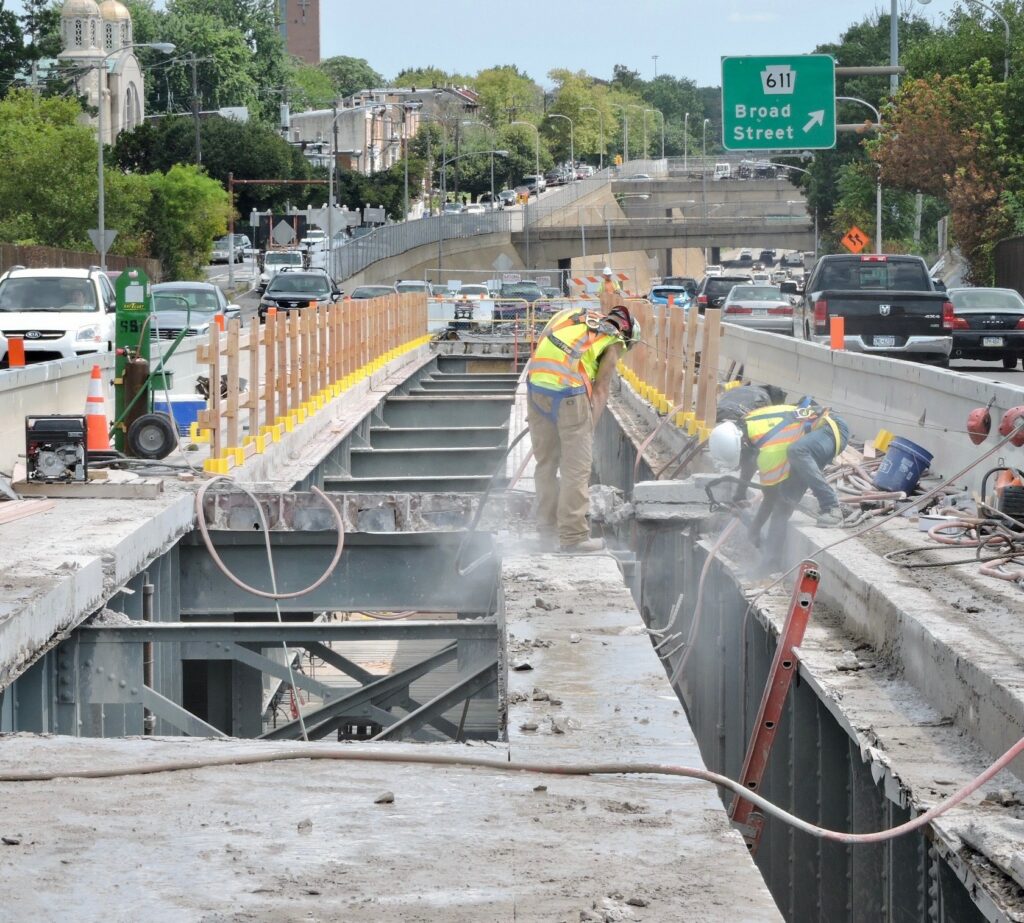 Crews remove the concrete deck